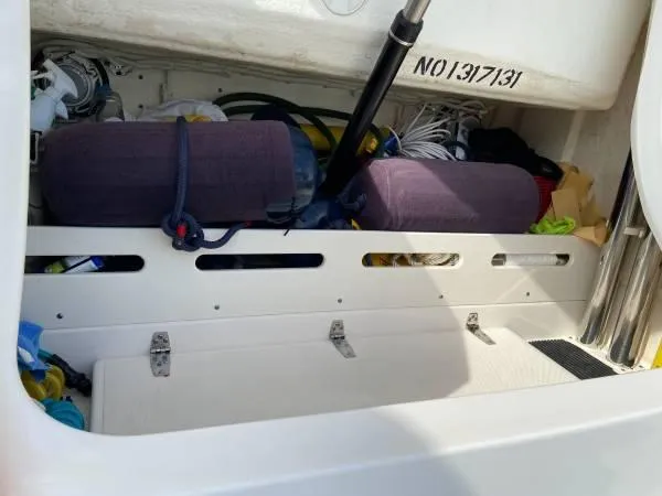 Slide: The Image of Storage compartment of 2019 Tiara Sport 39 boat with equipment and gear. - 14