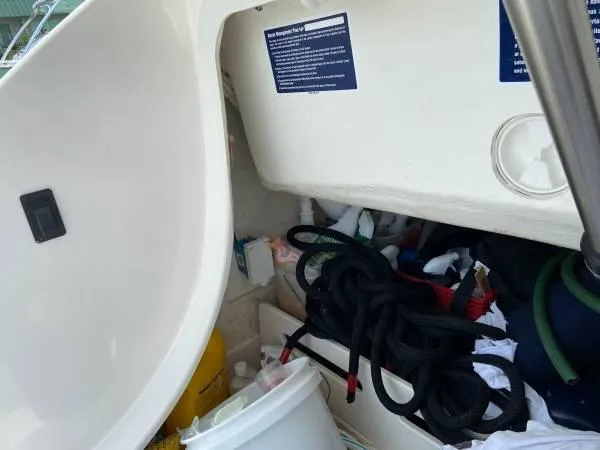 Slide: The Image of Storage compartment of a 2019 Tiara Sport 39 boat with ropes and supplies. - 15