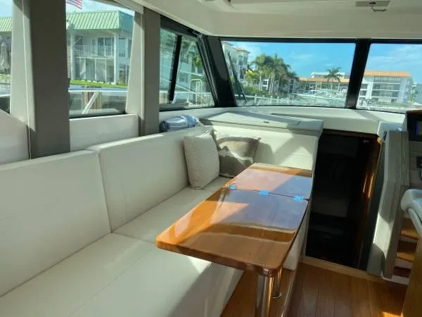 Slide: The Image of Luxurious interior of 2019 Tiara Sport 39 yacht with elegant seating and wooden table. - 2