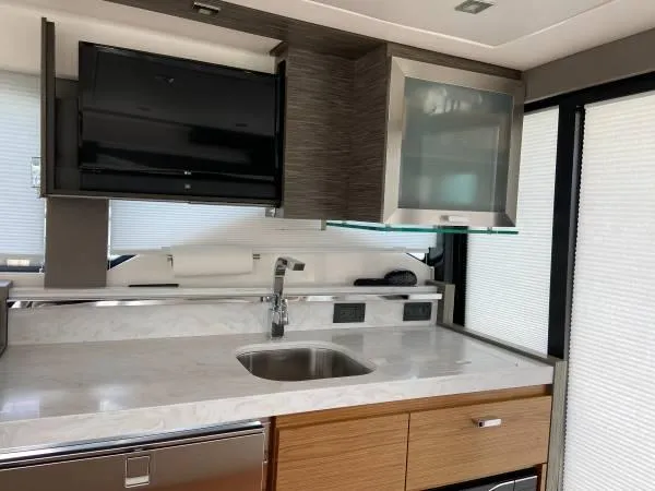 Slide: The Image of Modern kitchen interior of 2019 Tiara Sport 39 yacht with sleek cabinetry and appliances. - 3