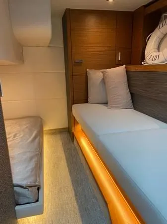 Slide: The Image of 2019 Tiara Sport 39 interior cabin with modern design and ambient lighting. - 6