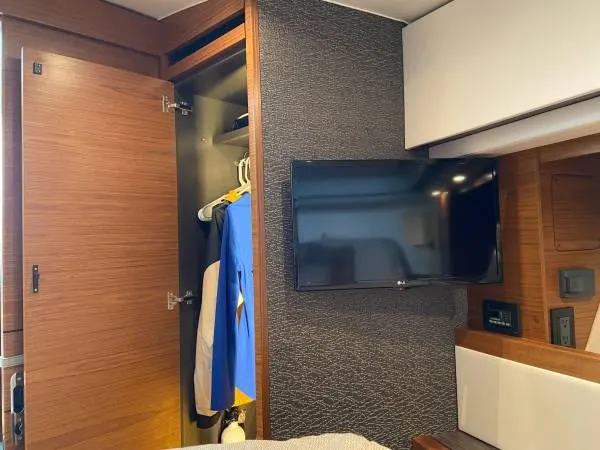 Slide: The Image of Interior of 2019 Tiara Sport 39 yacht with closet and mounted TV. - 8