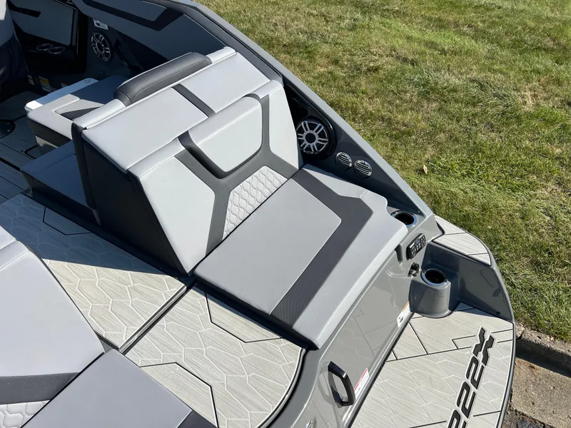 Slide: The Image of 2025 Yamaha Boats 222XD interior, featuring sleek gray seating and modern design elements. - 10