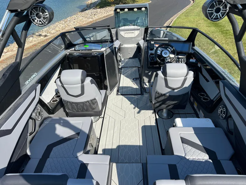 Slide: The Image of 2025 Yamaha Boats 222XD interior with modern seating and sleek design near water. - 12