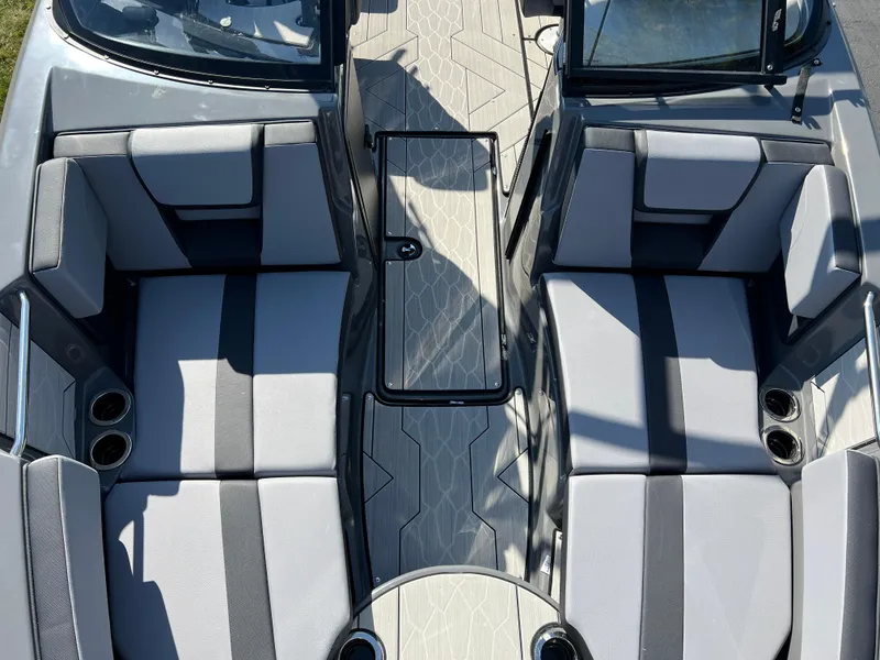 Slide: The Image of 2025 Yamaha Boats 222XD interior with gray seating and modern design. - 19