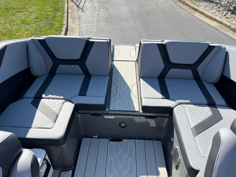 Slide: The Image of 2025 Yamaha Boats 222XD interior with modern gray seating and sleek design. - 22