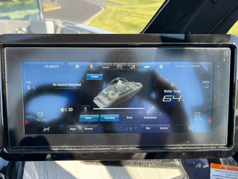 Slide: The Image of Yamaha Boats 222XD 2025 dashboard display showing boat controls and water temperature. - 30