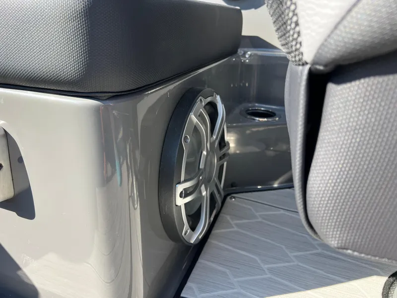 Slide: The Image of 2025 Yamaha Boats 222XD interior speaker detail with sleek seating and modern design. - 32