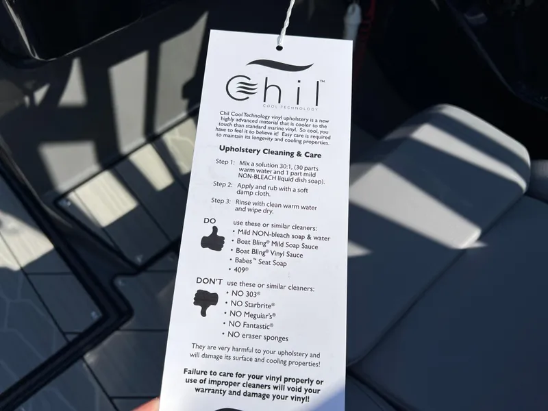 Slide: The Image of Yamaha Boats 2025 222XD upholstery care tag with cleaning instructions. - 33