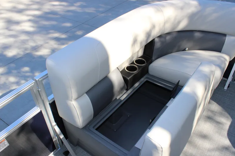 Slide: The Image of 2025 Starcraft LX 20 CB boat interior with gray seating and cup holders. - 10