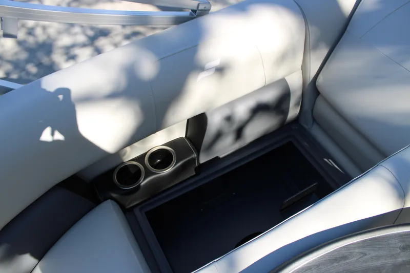 Slide: The Image of 2025 Starcraft LX 20 CB boat interior with cup holders and seating. - 5