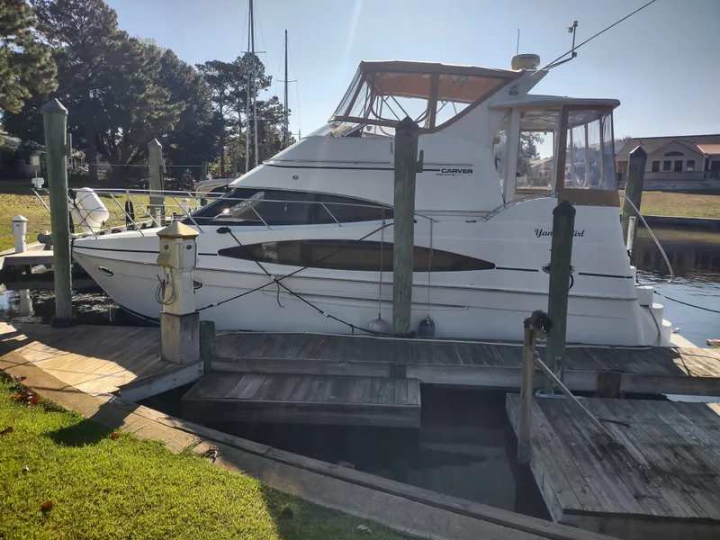 Slide: The Image of 2004 Carver 366 Motor Yacht docked at marina, side view. - 0