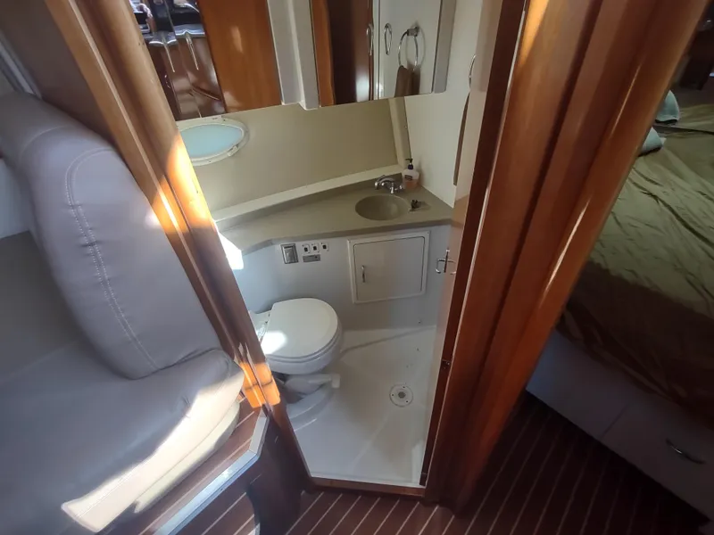 Slide: The Image of 2004 Carver 366 Motor Yacht bathroom with sink, toilet, and mirror. - 21