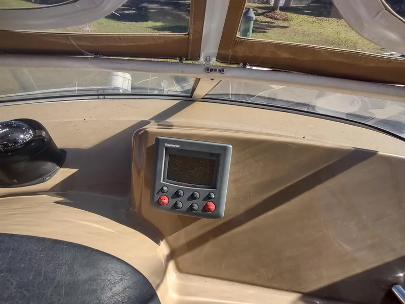 Slide: The Image of 2004 Carver 366 Motor Yacht dashboard with navigation controls and display. - 38