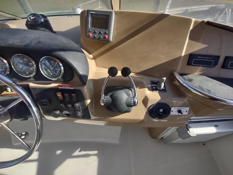 Slide: The Image of 2004 Carver 366 Motor Yacht helm with gauges and controls. - 39