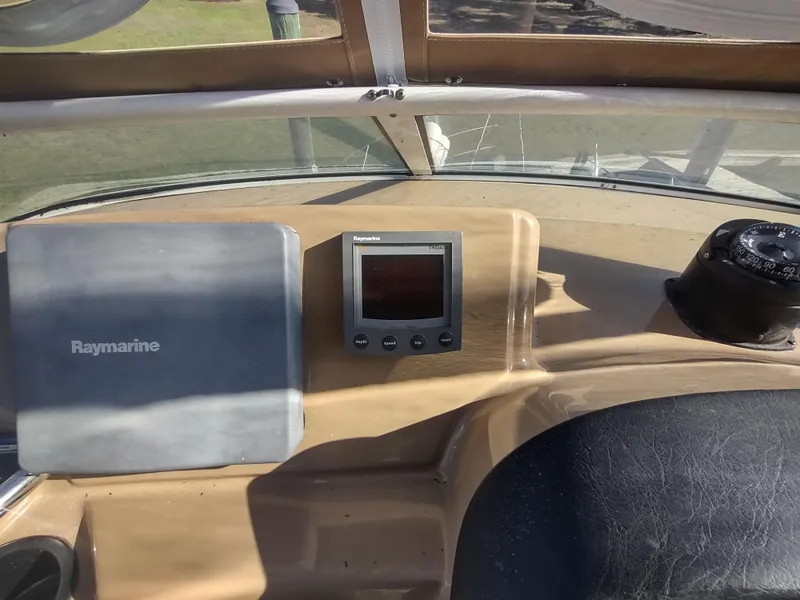 Slide: The Image of Dashboard of 2004 Carver 366 Motor Yacht with Raymarine navigation equipment. - 42