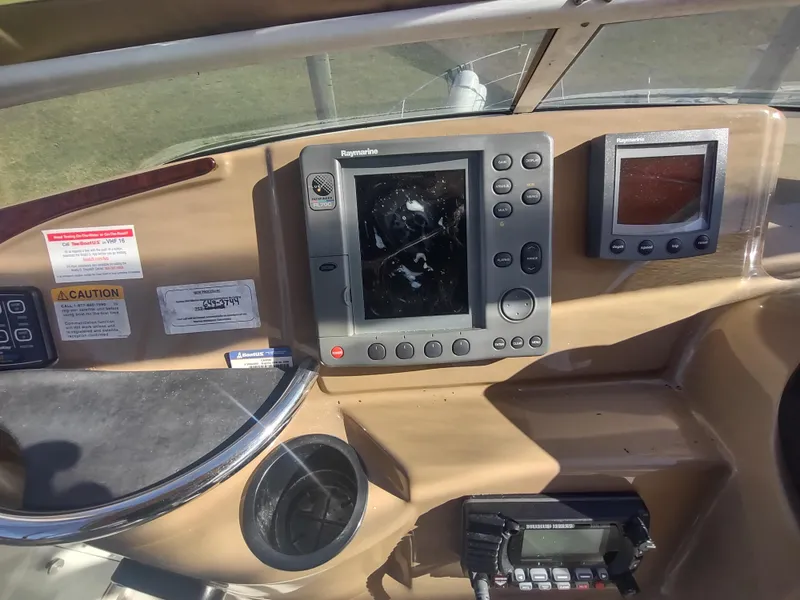 Slide: The Image of 2004 Carver 366 Motor Yacht dashboard with navigation equipment and controls. - 43