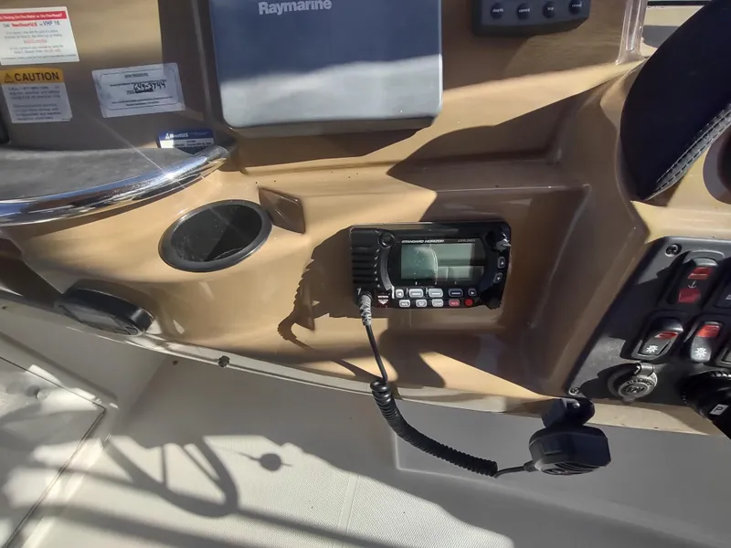 Slide: The Image of 2004 Carver 366 Motor Yacht dashboard with radio and navigation equipment. - 44