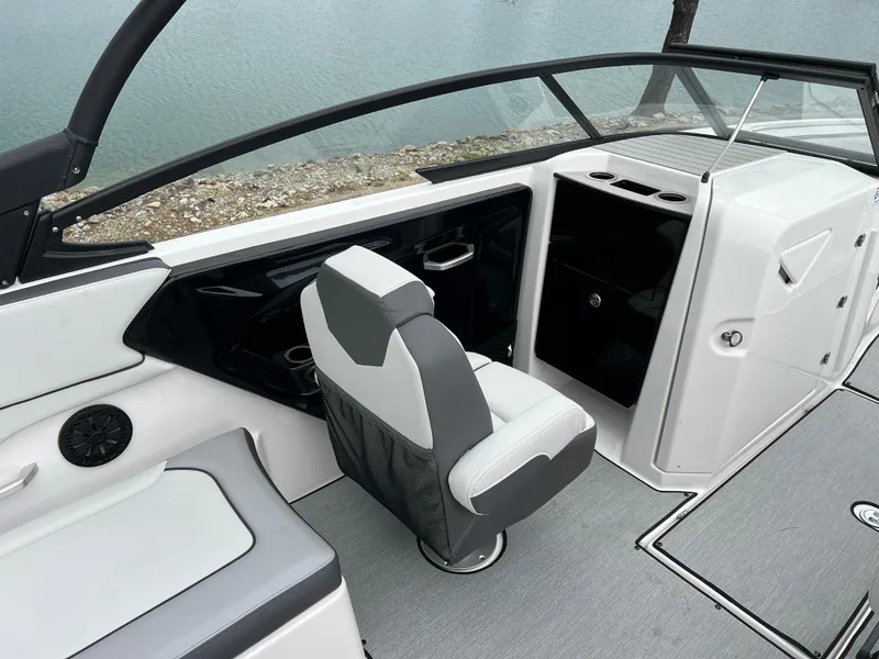 Slide: The Image of 2025 Yamaha Boats AR250 interior with sleek seating and modern dashboard design. - 10