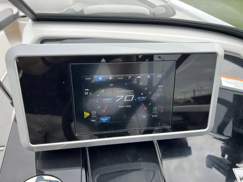 Slide: The Image of Dashboard display of 2025 Yamaha Boats AR250 showing speedometer and controls. - 12