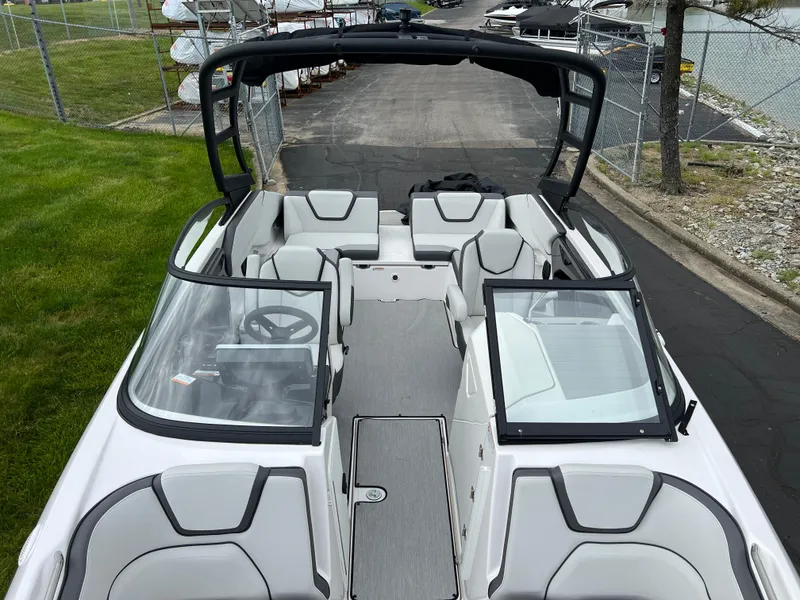 Slide: The Image of 2025 Yamaha Boats AR250 interior with sleek seating and modern design. - 21