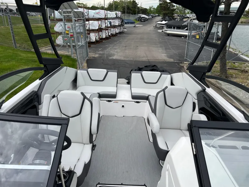 Slide: The Image of 2025 Yamaha Boats AR250 interior with spacious seating and modern design. - 22