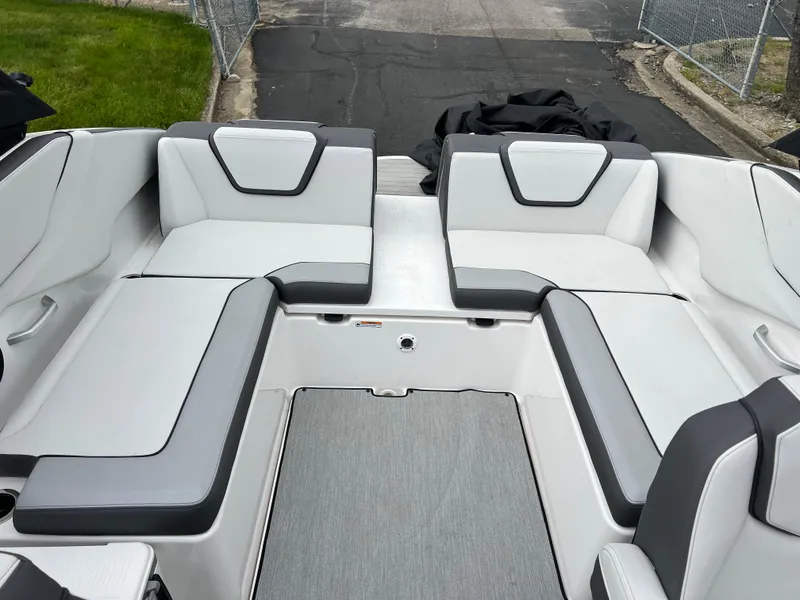 Slide: The Image of 2025 Yamaha Boats AR250 interior with sleek, modern seating design. - 25