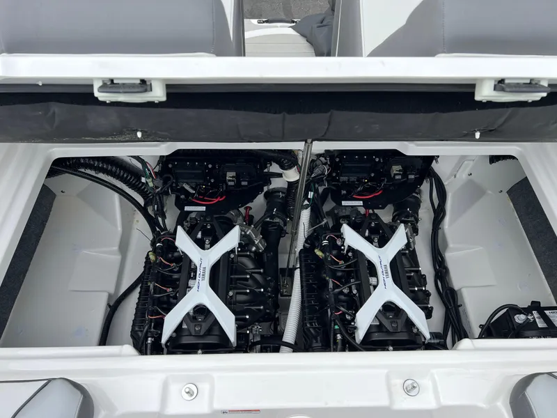 Slide: The Image of 2025 Yamaha Boats AR250 engine compartment with dual engines, showcasing advanced marine technology. - 26