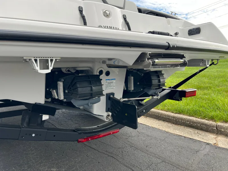 Slide: The Image of 2025 Yamaha Boats AR250 rear view showing dual jet propulsion system on trailer. - 7
