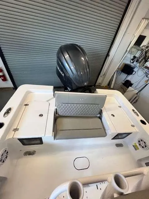 Slide: The Image of 2025 Sportsman 227 MASTERS boat interior with Yamaha engine, featuring seating and storage compartments. - 10