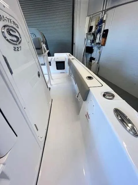 Slide: The Image of 2025 Sportsman 227 MASTERS boat interior, featuring sleek white design and modern fittings. - 4