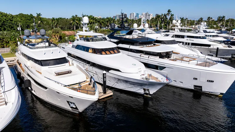 Slide: The Image of Luxurious Delta 124 Motoryacht 2001 docked among other yachts in a marina. - 14
