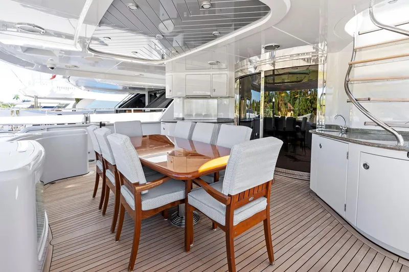 Slide: The Image of Luxurious dining area on 2001 Delta 124 Motoryacht with elegant wooden table and chairs. - 15