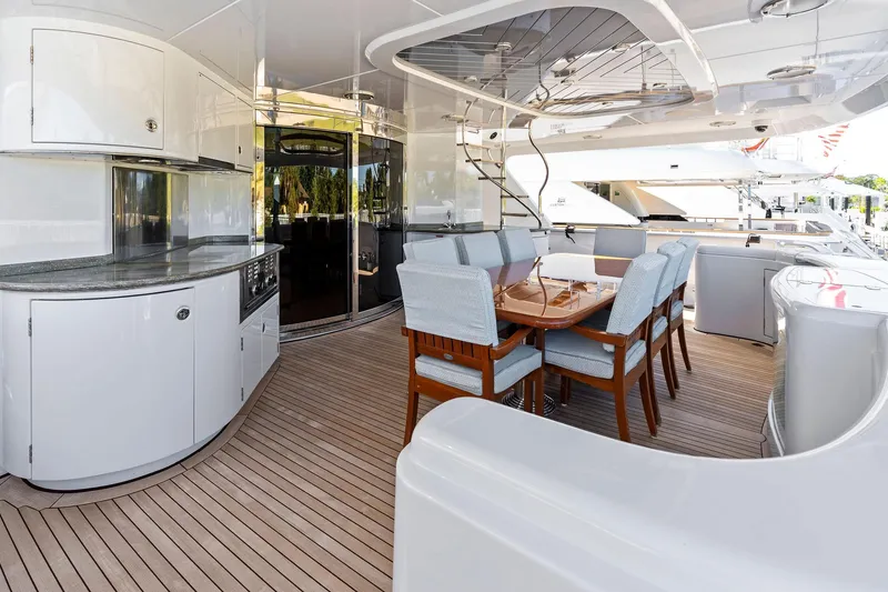 Slide: The Image of Luxurious Delta 124 Motoryacht 2001 with elegant outdoor dining area and modern amenities. - 16