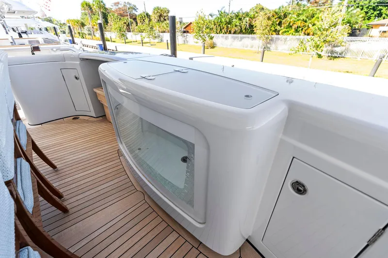 Slide: The Image of Luxurious deck of 2001 Delta 124 Motoryacht with sleek design and wooden flooring. - 17