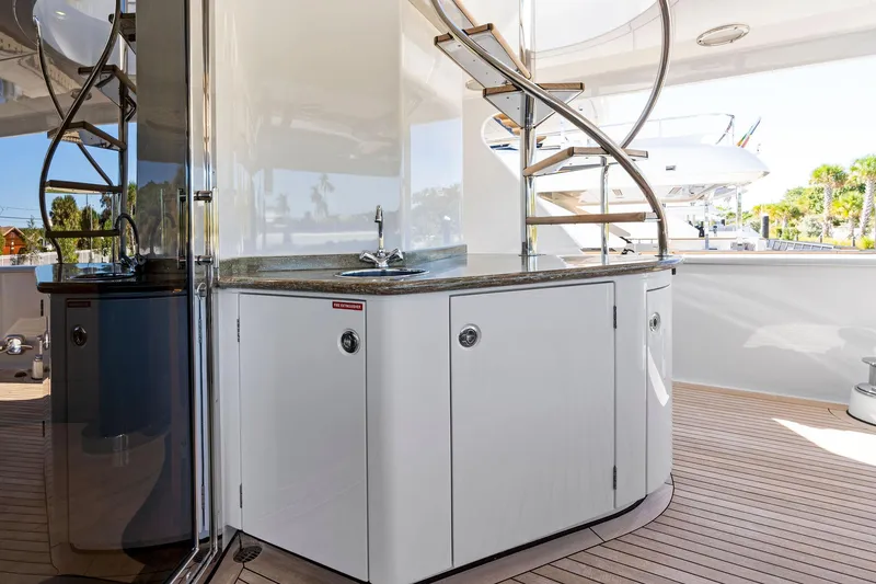 Slide: The Image of Luxurious Delta 124 Motoryacht 2001 with sleek interior and spiral staircase. - 19