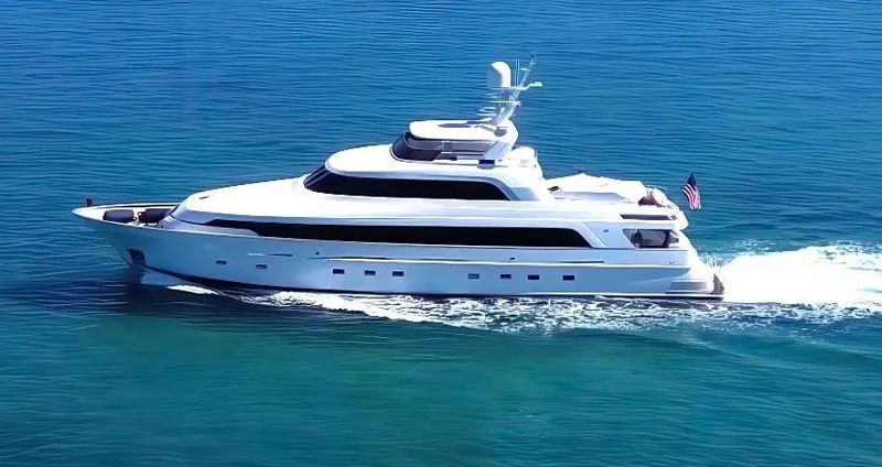 Slide: The Image of Delta Marine 124 Motor Yacht cruising on blue ocean waters, 2001 model. - 2
