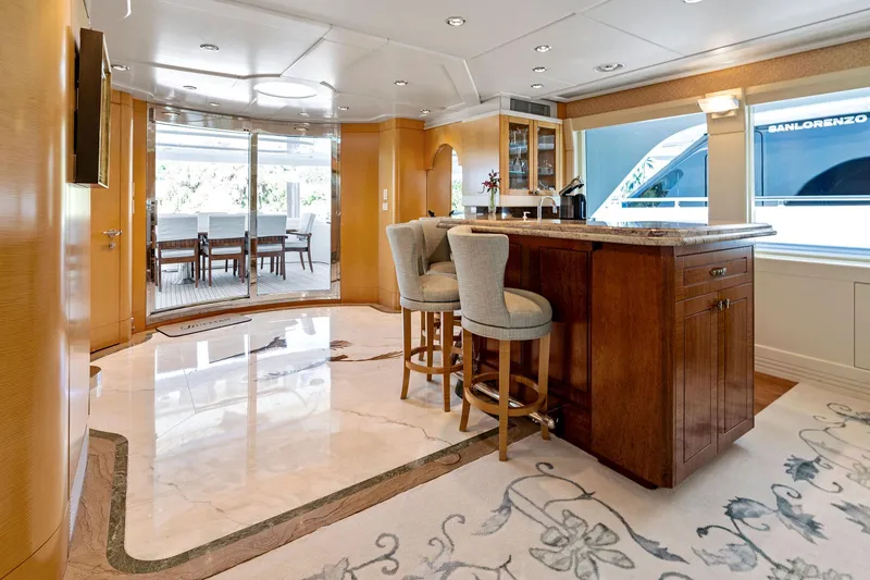 Slide: The Image of Luxurious interior of 2001 Delta 124 Motoryacht with elegant bar and seating area. - 25