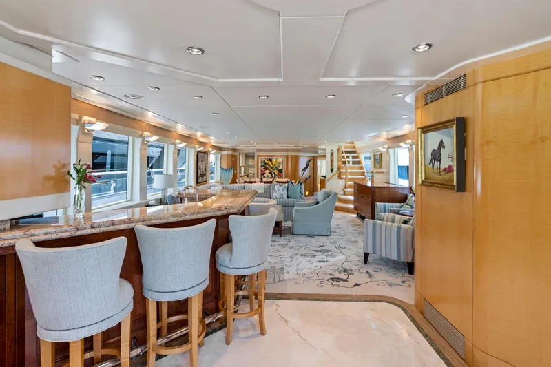 Slide: The Image of Luxurious interior of 2001 Delta 124 Motoryacht with elegant seating and bar area. - 26