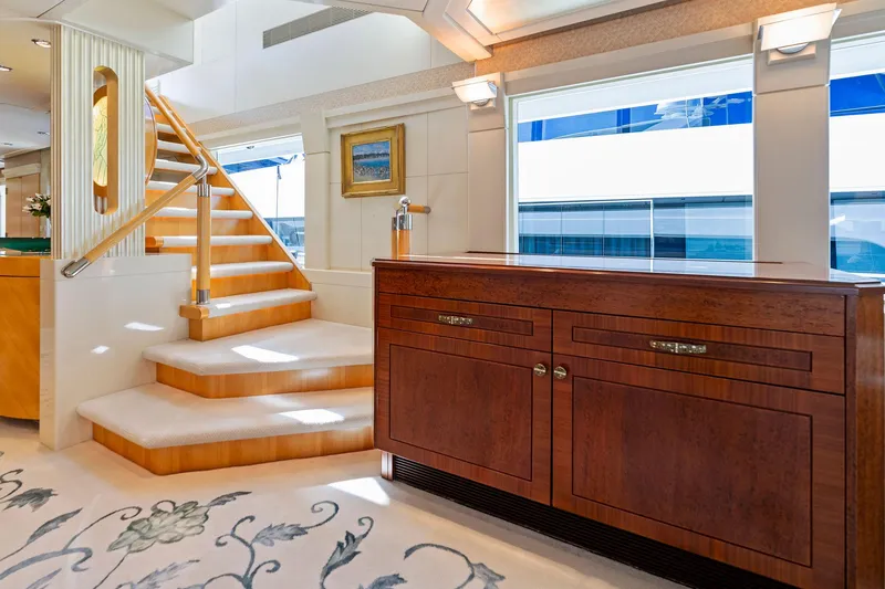 Slide: The Image of Luxurious interior of 2001 Delta 124 Motoryacht with elegant staircase and wooden cabinetry. - 27