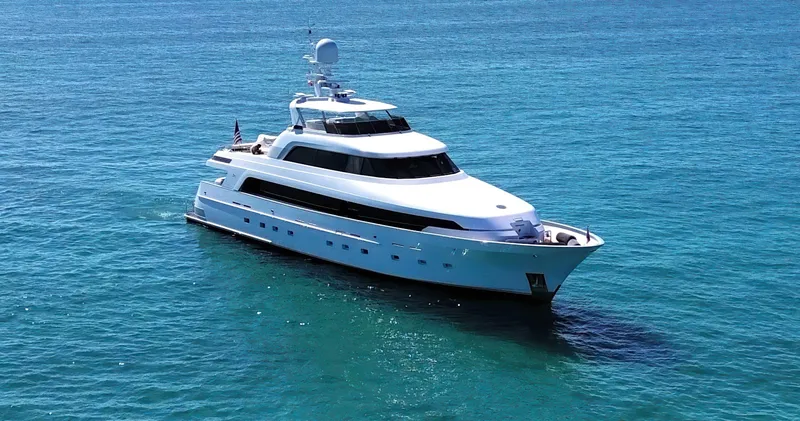 Slide: The Image of Delta Marine 124 Motor Yacht, 2001, cruising on clear blue ocean waters. - 3