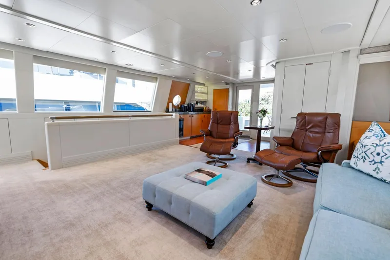 Slide: The Image of Luxurious interior of 2001 Delta 124 Motoryacht with modern seating and large windows. - 53