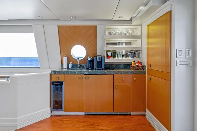 Slide: The Image of Luxurious galley on 2001 Delta 124 Motoryacht with modern cabinetry and appliances. - 55