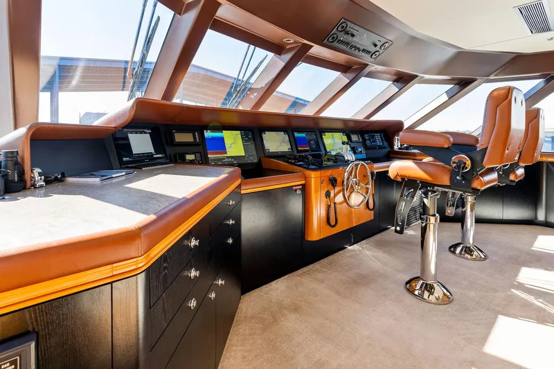 Slide: The Image of Luxurious helm of 2001 Delta 124 Motoryacht with advanced navigation systems. - 60