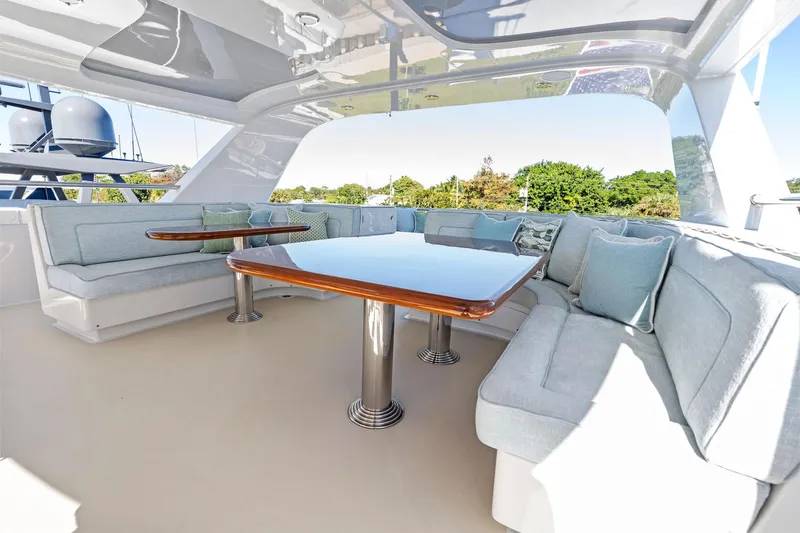 Slide: The Image of Luxurious seating area on 2001 Delta 124 Motoryacht with elegant tables and cushions. - 67
