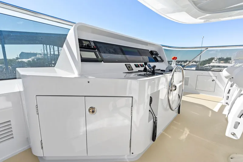 Slide: The Image of Delta 124 Motoryacht 2001 helm station with modern controls and panoramic view. - 71
