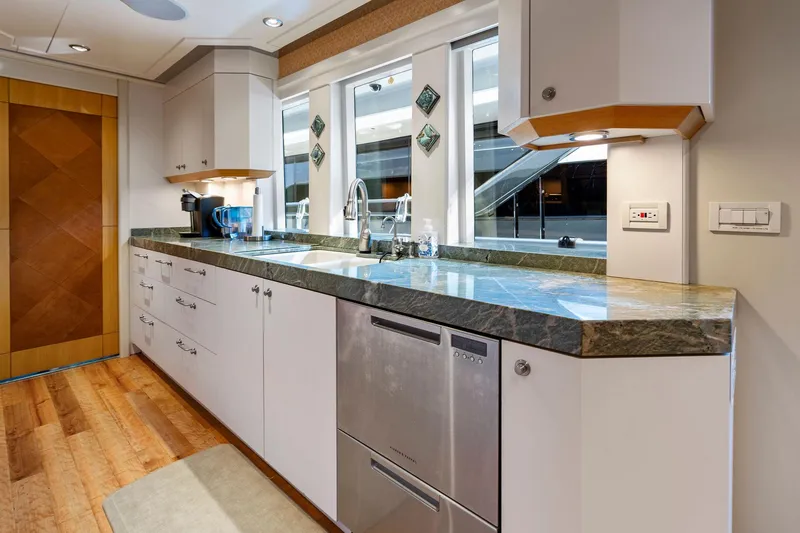 Slide: The Image of Luxurious kitchen interior on 2001 Delta 124 Motoryacht with modern appliances and sleek design. - 74