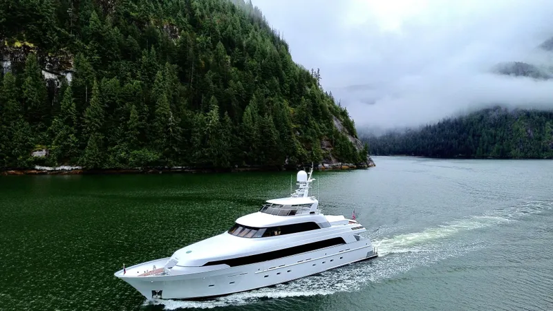 Slide: The Image of Delta Motoryacht 2001 cruising through scenic forested waters. - 9