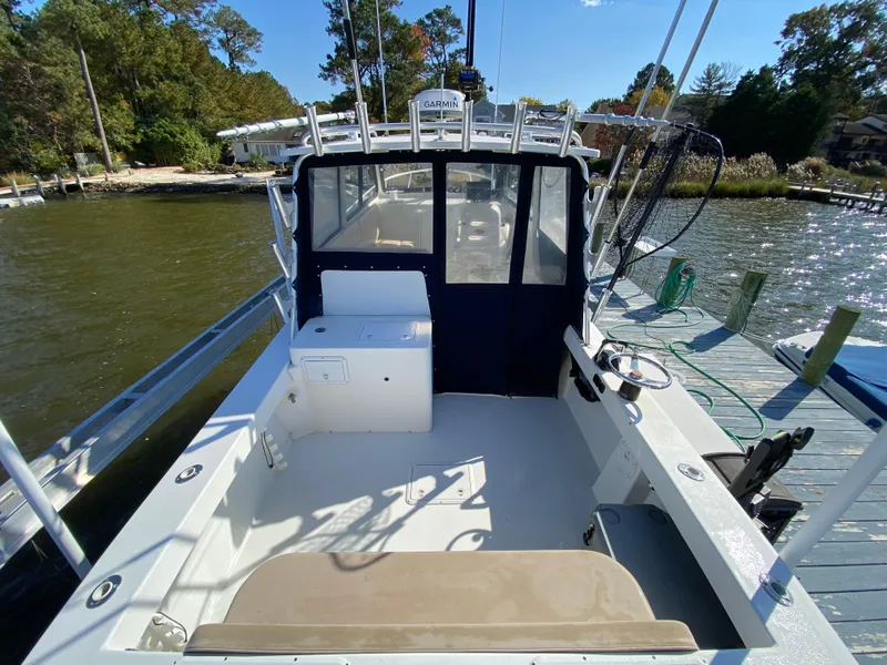 Slide: The Image of 2018 Judge 27 Chesapeake XL boat docked by a scenic waterfront. - 14