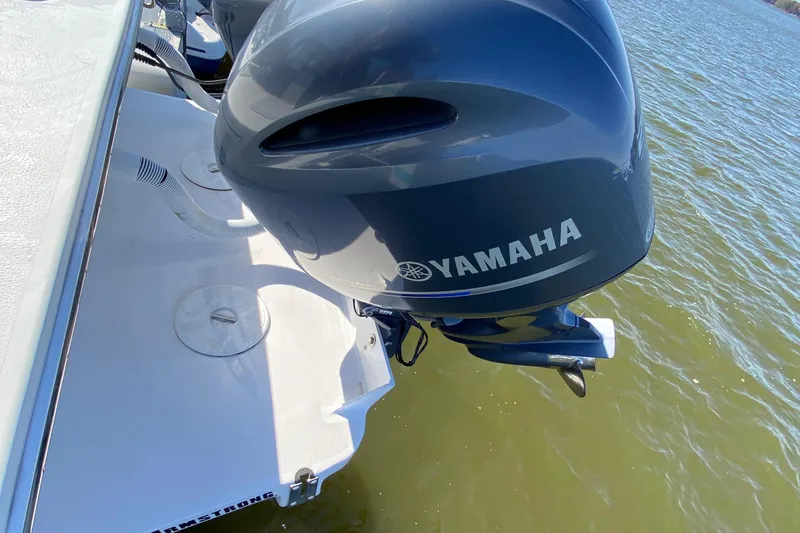 Slide: The Image of 2018 Judge 27 Chesapeake XL with Yamaha outboard motor on water. - 20